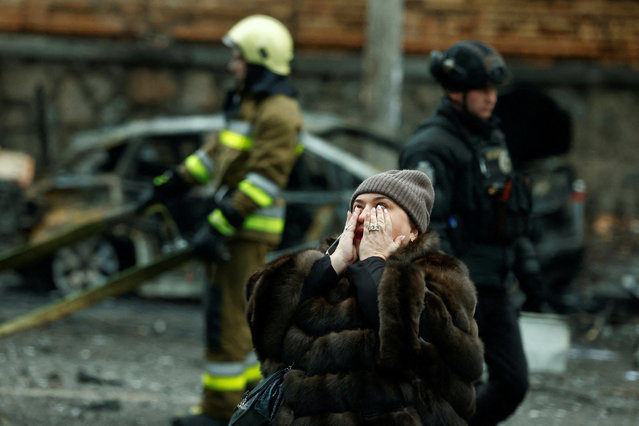 A woman reacts at the site of a Russian missile strike, amid Russia's attack on Ukraine, in central Kyiv, Ukraine, on December 20, 2024. (Photo by Thomas Peter/Reuters)