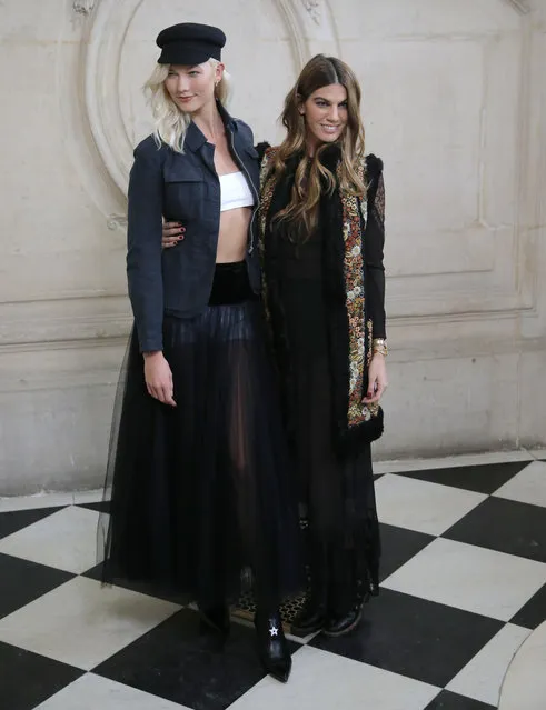 Models Karlie Kloss, left, and Bianca Brandolini D'Adda pose for photographers before the presentation of Christian Dior's Spring-Summer 2018 ready-to-wear fashion collection in Paris, Tuesday, September 26, 2017. (Photo by Michel Euler/AP Photo)