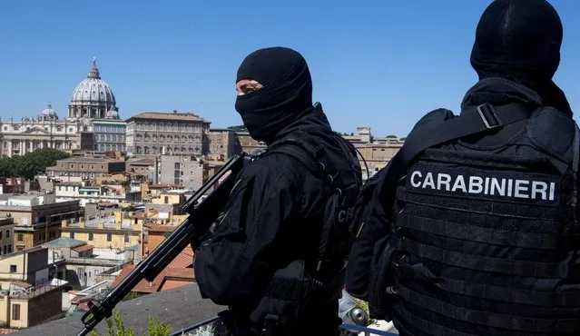 Carabinieri (Italian paramilitary police) special unit's officers patrol the area next to St. Peter's Basilica, background left, in Rome, Tuesday, August 9, 2016. Anti-terrorism measures have been tightened in Rome. They include the stationing of police cars and van at the end of a boulevard that runs past the Colosseum, and police patrols and surveillance along Via del Corso, a long street lined with clothing shops and which also runs by the premier's office. (Photo by Claudio Peri/ANSA via AP Photo)