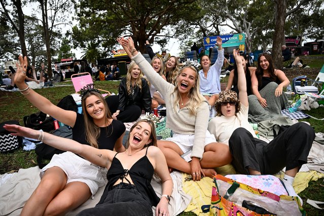Revellers are seen at Mrs Macquaries Point, ahead of New Year's Eve celebrations in Sydney on Sunday, December 31, 2023. (Photo by Dan Himbrechts/AAP Image)