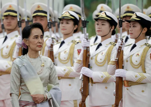 Myanmar State Counselor Aung San Suu Kyi reviews honour guards during a welcoming ceremony at the Great Hall of the People in Beijing, China, August 18, 2016. (Photo by Jason Lee/Reuters)