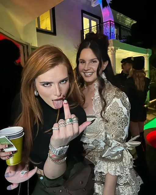 American actress and model Bella Thorne in the last decade of October 2022 sticks her finger up at her own Halloween party with American singer-songwriter Lana Del Rey. (Photo by bellathorne/Instagram)