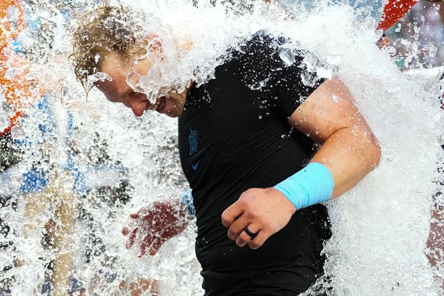 Kyle Stowers #28 of the Miami Marlins receives a gatorade bath after hitting a walk off single to defeat Pittsburgh Pirates on their Opening Day game at loanDepot park on March 27, 2025 in Miami, Florida. (Photo by Rich Storry/Getty Images)