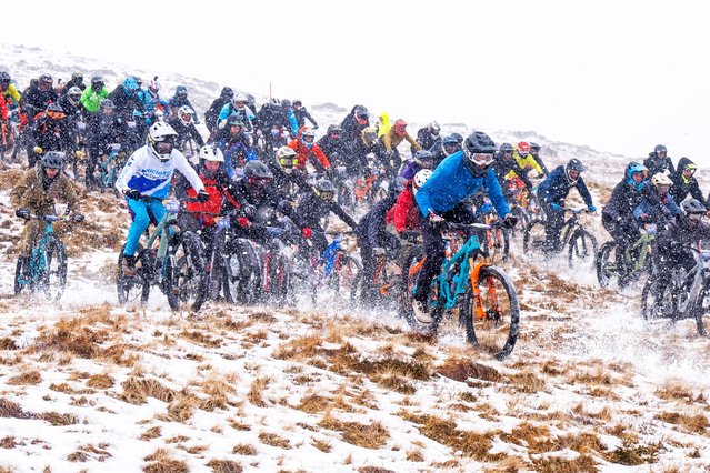 Over 300 cyclists take part in MacAvalanche, a mass-start mountain bike race through the snow, descending over 900m from the summit of Aonach Mor in the Nevis Range near Fort William, UK on Saturday, March 29, 2025. (Photo by Jane Barlow/PA Wire)