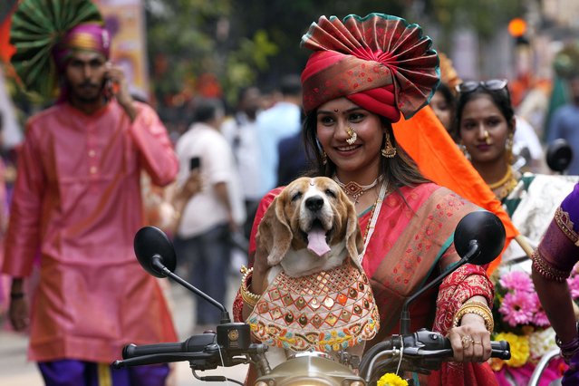 A woman dressed in traditional attire participates in a procession to mark Gudi Padwa or the Marathi New Year in Mumbai, India, Sunday, March 30, 2025. (Photo by Rajanish Kakade/AP Photo)