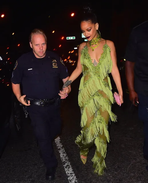 Rihanna and Drake basically confirmed their couple rumors at the VMA's on on August 28, 2016. The pair arrived to Up and Down nightclub in the same car at 3am after a private dinner. They both beamed happily as they headed into the club. Rihanna stunned in a green dress with tons of fringe swinging around. They left together at 5am and spent the night at Drake's Hotel. (Photo by PAPS.TV/Splash News)