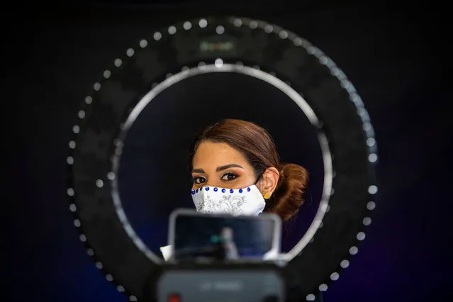 Tamara Rios, contestant for “Miss Nicaragua”, wears a face mask against the spread of the new coronavirus during a presentation ahead of the event in Managua on July 22, 2020. (Photo by Inti Ocon/AFP Photo)