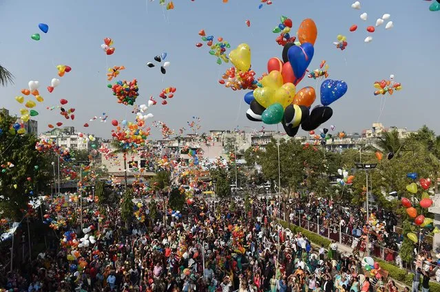 Indian Christians release balloons in the sky as they welcome 2018 in Ahmedabad on January 1, 2018. Thousands of Christians assembled at Methodist Church Maninagar after their prayers. (Photo by Sam Panthaky/AFP Photo)
