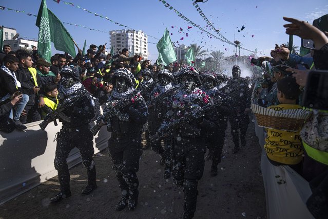 Members of the Izz ad-Din al Qassam Brigades, the armed wing of the Palestinian group Hamas, parade on Hamas' 35th anniversary in Gaza City, Wednesday, December 14, 2022. Hundreds of thousands of Palestinians thronged the rally in downtown Gaza to mark the founding of the militant group, as leaders predicted a year of “open confrontation” with the hardline Israeli government expected to take office in the coming days. (Photo by Fatima Shbair/AP Photo)