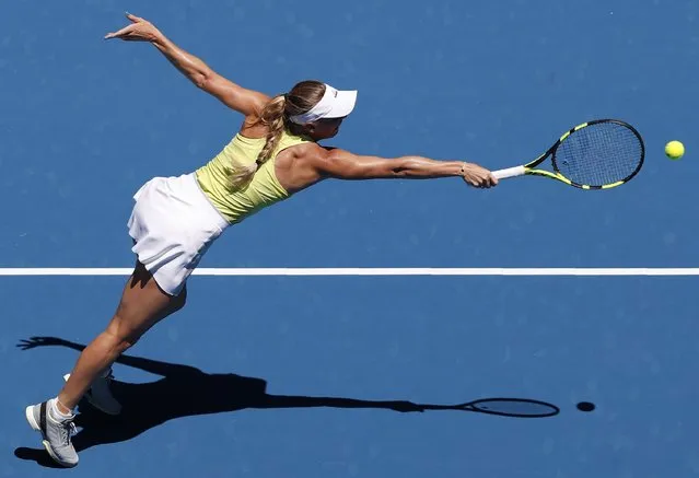 Denmark' s Caroline Wozniacki hits a return against Croatia' s Jana Fett during their women' s singles second round match on day three of the Australian Open tennis tournament in Melbourne on January 17, 2018. (Photo by Issei Kato/Reuters)