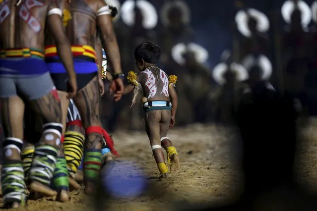 An indigenous boy takes part in the opening ceremony of the first World Games for Indigenous Peoples in Palmas, Brazil, October 23, 2015. (Photo by Ueslei Marcelino/Reuters)