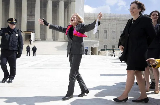 Edie Windsor, plaintiff in the hearing against the Defense of Marriage Act, celebrates after arguments outside the Supreme Court in Washington on March 27, 2013. When Edith Windsor got engaged in the 1960s to the woman who eventually became her wife she asked for a pin instead of a ring. A ring would have meant awkward questions, she said: Who is he? And when do we meet him? On Wednesday, the 83-year-old stood in front of the U.S. Supreme Court, the face of a case that could change how the U.S. government treats married gay couples. Windsor, whose wife Thea Spyer died in 2009, sued to challenge a $363,000 federal estate tax bill she got after Spyer's death. The pair married in Canada in 2007. Had Windsor been married to a man she would not have paid any estate tax. (Photo by Joshua Roberts/Reuters)