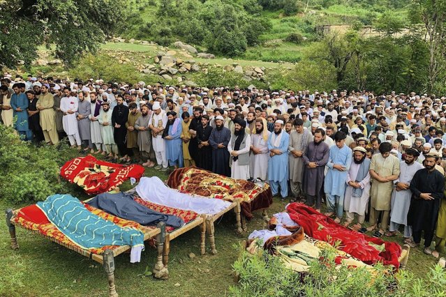 People attend funeral prayers of the victims of cloudburst incident, in Salarzai, Pakistan, Friday, August 15, 2025. (Photo by Anwarullah Khan/AP Photo)