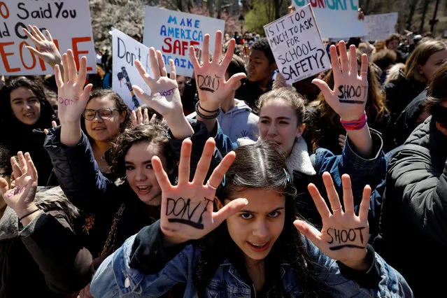 Students gather for a rally in Washington Square Park, as part of a nationwide walk-out of classes to mark the 19th anniversary of the Columbine High School mass shooting, in New York City, U.S., April 20, 2018. (Photo by Brendan McDermid/Reuters)