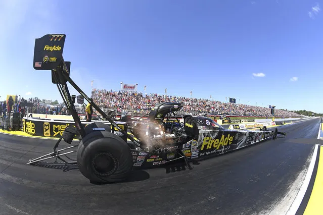 In this photo provided by the NHRA, Leah Pritchett competes in the Top Fuel final elimination racing at the 38th NHRA Southern Nationals at Atlanta Dragway in Commerce, Ga., Sunday, May 6, 2018. Pritchett piloted her FireAde dragster to a pass of 3.874 seconds at 322.42 mph during the final round of eliminations to defeat Blake Alexander. This is Pritchett's first Wally since Brainerd 2017, first event victory at Atlanta Raceway, and sixth overall. (Photo by Marc Gewertz/NHRA via AP Photo)