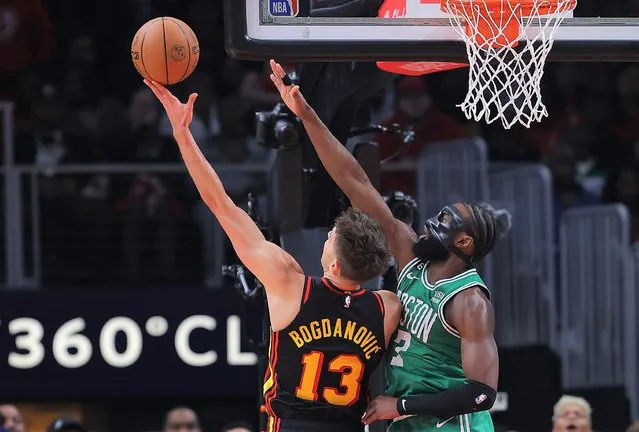 Bogdan Bogdanovic #13 of the Atlanta Hawks scores as he drives against Jaylen Brown #7 of the Boston Celtics during the second quarter of Game Six of the Eastern Conference First Round Playoffs at State Farm Arena on April 27, 2023 in Atlanta, Georgia. (Photo by Kevin C. Cox/Getty Images)