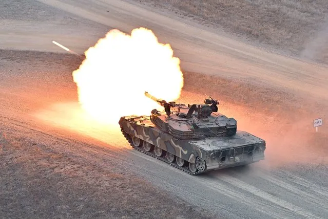 A South Korean K1A1 tank fires during a Warrior Shield live fire exercise at a military training field in Pocheon on March 22, 2023, as part of the Freedom Shield joint military exercise. South Korea and the United States kicked off the Freedom Shield joint military exercise, their largest drills in five years, which will run for 10 days from March 13, 2023 as part of the allies drive to counter North Korea's growing threats. (Photo by Jung Yeon-je/AFP Photo)