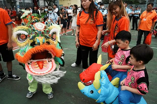 Young participants take part in a parade celebrating Tin Hau festival at Yuen Long district, in Hong Kong, China on May 12, 2023. (Photo by Lam Yik/Reuters)