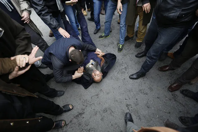 Demonstrators try to help a fellow demonstrator who fainted during a protest against satirical French weekly newspaper Charlie Hebdo, after the Friday prayer in Amman January 16, 2015. (Photo by Muhammad Hamed/Reuters)