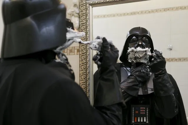 Darth Mykolaiovych Vader, who is dressed as the 'Star Wars' character Darth Vader, poses for a picture as he pretends to shave in a bathroom at his apartments in Odessa, December 2, 2015. (Photo by Valentyn Ogirenko/Reuters)