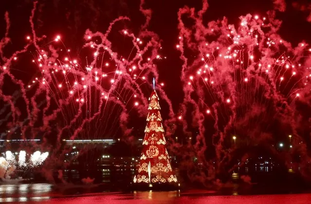 Fireworks explode around Rio's Christmas tree during its lighting ceremony at Rodrigo de Freitas Lagoon in Rio de Janeiro, Brazil, December 12, 2015. (Photo by Sergio Moraes/Reuters)