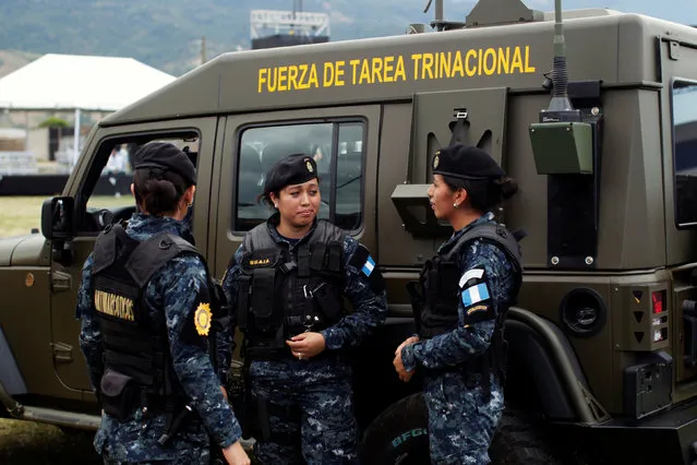 Guatemalan policewomen talk prior to the Tri-National anti gang task force deployment ceremony in Nueva Ocotepeque, Honduras,  November 15, 2016. (Photo by Jose Cabezas/Reuters)