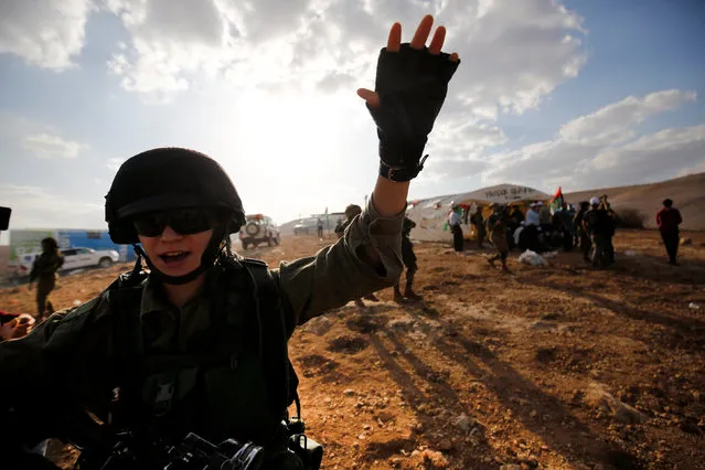 An Israeli soldier gestures during a protest against Jewish settlements in Jordan Valley near the West Bank city of Jericho November 17, 2016. (Photo by Mohamad Torokman/Reuters)