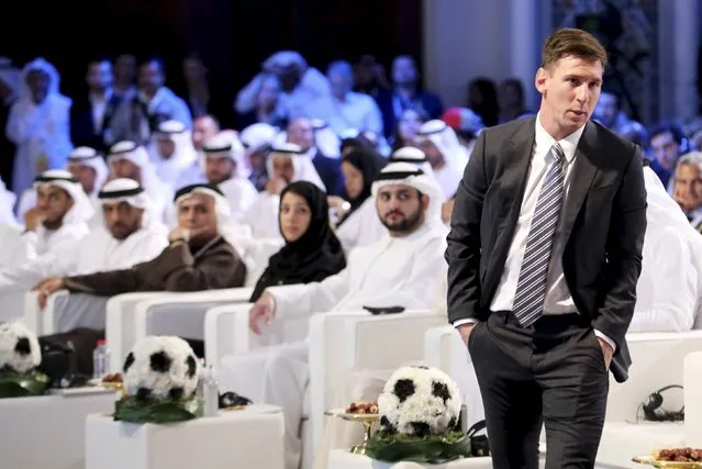 Barcelona's soccer player Lionel Messi (R) attends the Dubai International Sports Conference, in Dubai, United Arab Emirates December 27, 2015. (Photo by Ashraf Mohammad/Reuters)