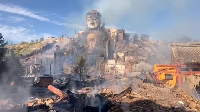 A view of damage caused by a fire in the wooden structure of the Grand Hall of the Dafo (Big Buddha) Temple in Zhangye, Gansu Province, China in this screen grab taken from a video released July 24, 2023. (Video obtained by Reuters)