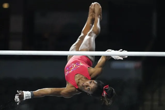 Simone Biles, a seven-time Olympic medalist and the 2016 Olympic champion, practices on the uneven bars at the U.S. Classic gymnastics competition Friday, August 4, 2023, in Hoffman Estates, Ill. (Photo by Erin Hooley/AP Photo)