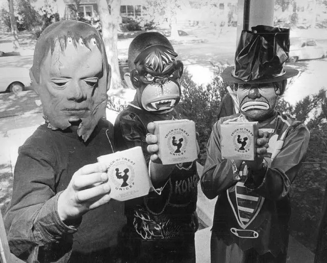 Behind those fearsome masks are Danny Hess, Dale Helzer and Cindy Gilbaugh, all 10, who will be among Greeley, Colo., school pupils working for UNICEF on Halloween in 1963. (Photo by The Denver Post)