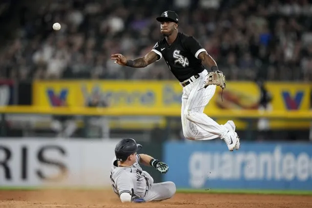 Chicago White Sox shortstop Tim Anderson forces New York Yankees' Harrison Bader out at second and gets Kyle Higashioka at first to turn the double play during the seventh inning of a baseball game, Wednesday, August 9, 2023, in Chicago. (Photo by Charles Rex Arbogast/AP Photo)