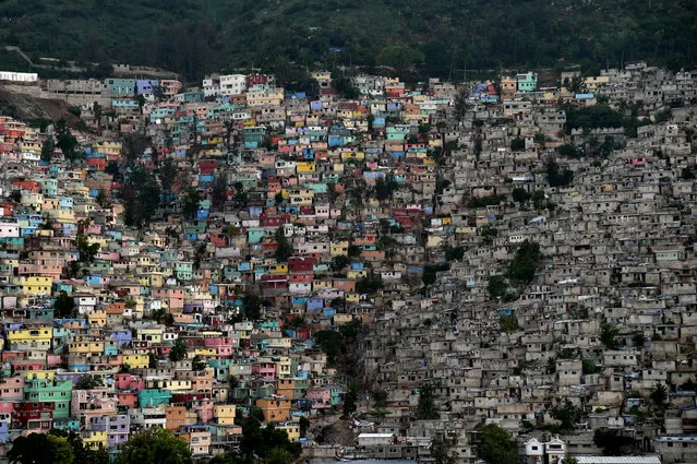 The neighborhoods of  Jalousie (L), Philippeaux (C) and Desermites (R) in the commune of Petion Ville, Port au-Prince are pictured on October 26, 2015. (Photo by Hector Retamal/AFP Photo)