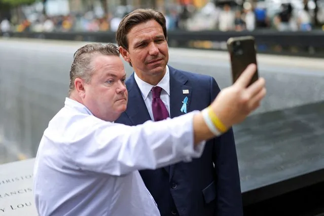 Florida Governor Ron DeSantis poses for selfie, on the day of the 22nd anniversary of the September 11, 2001 attacks on the World Trade Center at the National September 11 Memorial & Museum, in New York City, U.S., September 11, 2023. (Photo by Andrew Kelly/Reuters)
