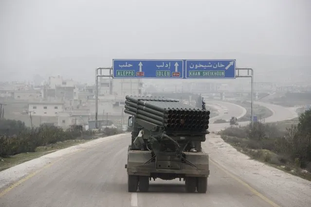 Al-Furqan brigade fighters, part of the Free Syrian Army, drive a Grad rocket launcher across a highway in Khan Sheikoun, Idlib countryside January 17, 2015. (Photo by Mohamad Bayoush/Reuters)