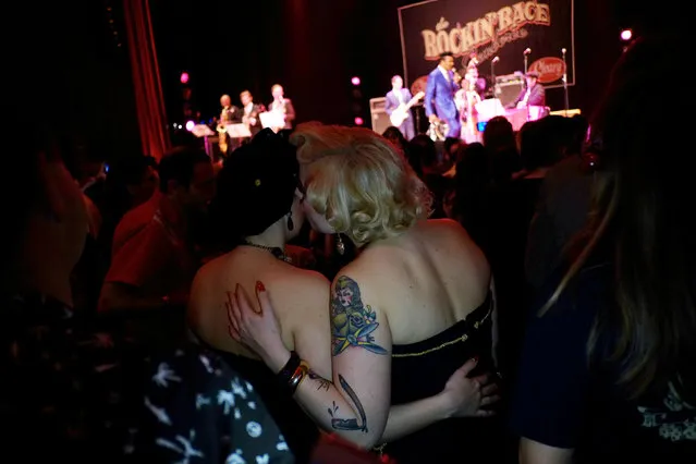 Women dressed in fifties-style outfits, chat as they attend a concert during the 22nd Rockin' Race Jamboree International Festival in Torremolinos, near Malaga, southern Spain, February 6, 2016. About 2,000 people attended the four-day festival, which is a music party for rock 'n' roll music lovers. (Photo by Jon Nazca/Reuters)