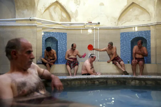 In this Wednesday, October 15, 2014 photo, a group of men bathe at the Nezafat public bathhouse, in Tabriz, Iran. (Photo by Ebrahim Noroozi/AP Photo)