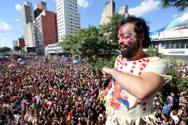 Revellers parade during the annual block party known as “To de Bowie” (Meanwhile, I'm with David Bowie), in downtown Sao Paulo, Brazil February 9, 2016. (Photo by Paulo Whitaker/Reuters)