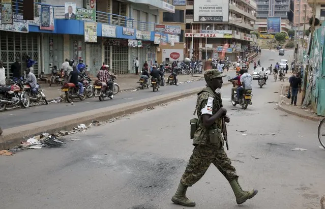 An Ugandan soldier patrols a street in Kampala, Uganda February 20, 2016. (Photo by Goran Tomasevic/Reuters)