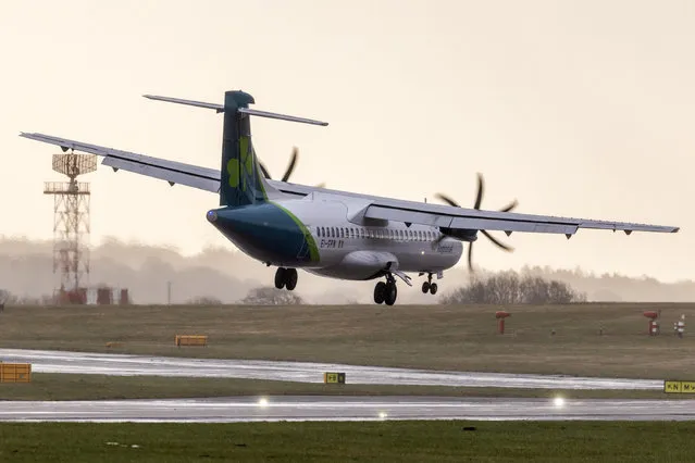 A Aer Lingus aircraft arriving from Belfast City is blown side ways forcing it to abort its landing this morning in the strong winds at Leeds Bradford airport in Yorkshire on March 13, 2023. The aircraft circled the airport three times before eventually landing. (Photo by Andrew McCaren/London News Pictures)