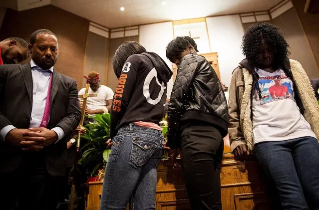 Gloria Darden (R), mother of Freddie Gray, gathers with family and clergy in Baltimore, Maryland April 27, 2015. (Photo by Eric Thayer/Reuters)