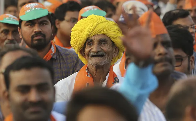An elderly supporter of ruling Bharatiya Janata Party (BJP) smiles a he attends an election campaign rally addressed by Indian Prime Minister Narendra Modi in Hyderabad, India, Monday, April 1, 2019. India's general elections will be held in seven phases starting April 11. (Photo by Mahesh Kumar A./AP Photo)