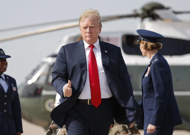 President Donald Trump gives a 'thumbs-up' as he prepares to board Air Force One, Thursday, April 18, 2019, at Andrews Air Force Base, Md. President Trump is traveling to his Mar-a-lago estate to spend the Easter weekend in Palm Beach, Fla. (Photo by Pablo Martinez Monsivais/AP Photo)