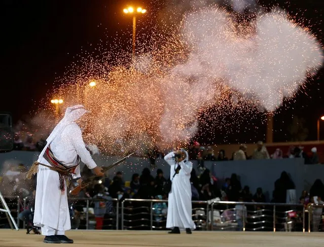 A Saudi man fires a weapon as he performs a traditional dance during the Janadriyah Culture Festival on the outskirts of Riyadh, Saudi Arabia, February 11, 2017. (Photo by Faisal Al Nasser/Reuters)