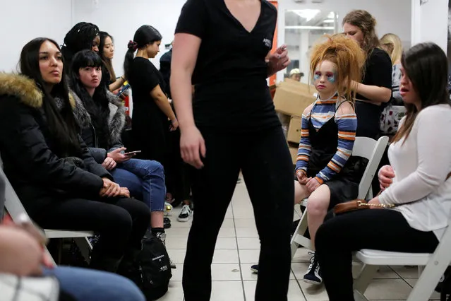 Australian model and designer Madeline Stuart, who has Down syndrome, waits in a seating area backstage before presenting creations from her label 21 Reasons Why By Madeline Stuart during New York Fashion Week in Manhattan, New York, U.S., February 12, 2017. (Photo by Andrew Kelly/Reuters)
