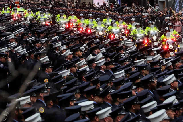 New York City Departament (FDNY) officers attend a funeral service of FDNY firefighter and U.S. Marine Christopher Slutman, in New York City, New York, U.S., April 26, 2019. (Photo by Jeenah Moon/Reuters)