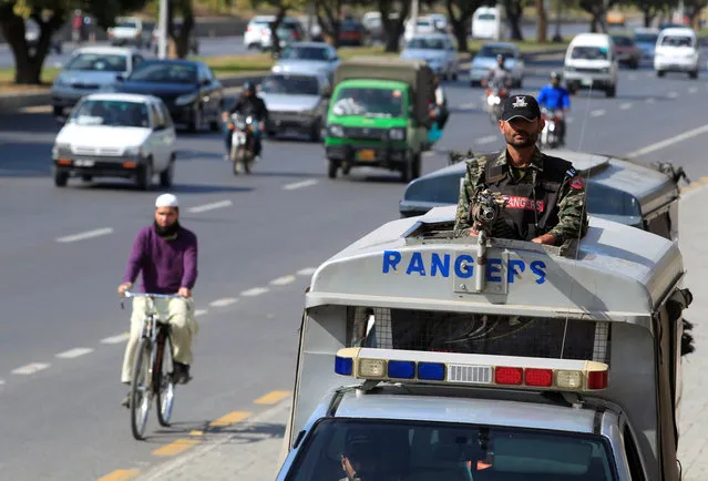 A Pakistani Rangers personel keeps guard while patroling on the streets in Islamabad, Pakistan, February 20, 2017. (Photo by Faisal Mahmood/Reuters)