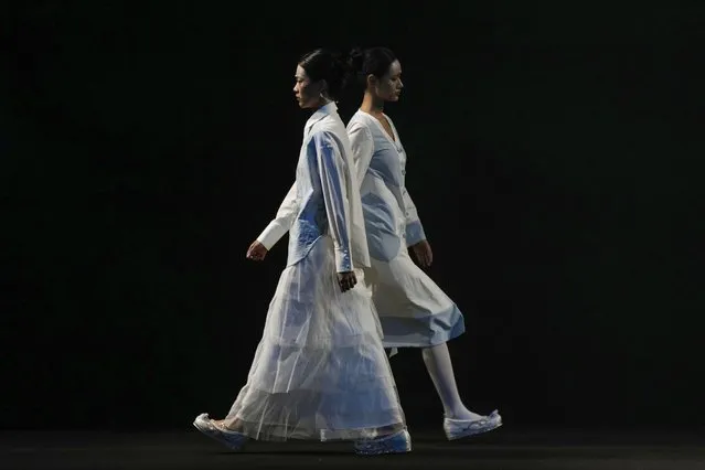 Models wear creations from Hanxi Zhang during the China Fashion Week in Beijing, Wednesday, March 27, 2024. (Photo by Tatan Syuflana/AP Photo)