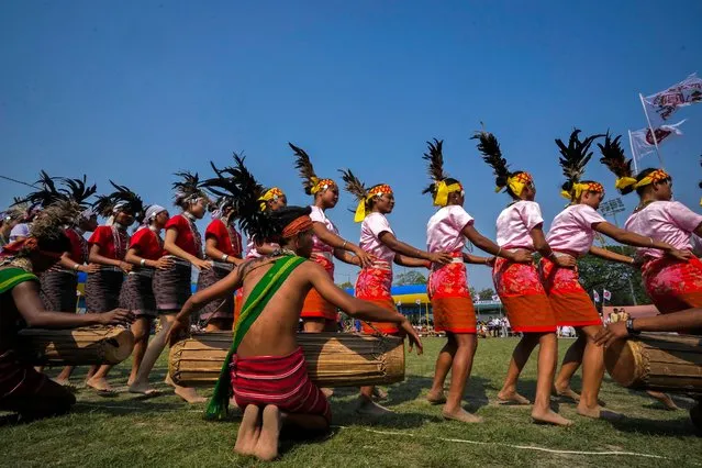 Girls from the Garo tribe perform a traditional Wangala dance during the Rongali Bihu festival, organized by All Assam Students Union in Guwahati, capital of the north eastern state of Assam, India, Saturday, April 13, 2024. The festival celebrates the arrival of spring and marks the beginning of the Assamese New Year. (Photo by Anupam Nath/AP Photo)