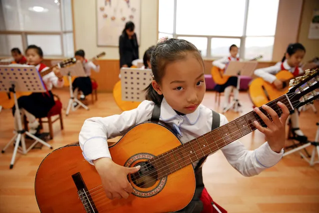 Girls play guitars at the Mangyongdae Children's Palace in central Pyongyang, North Korea May 5, 2016. (Photo by Damir Sagolj/Reuters)